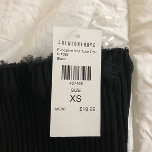 Knit tube dress code with frayed edges.